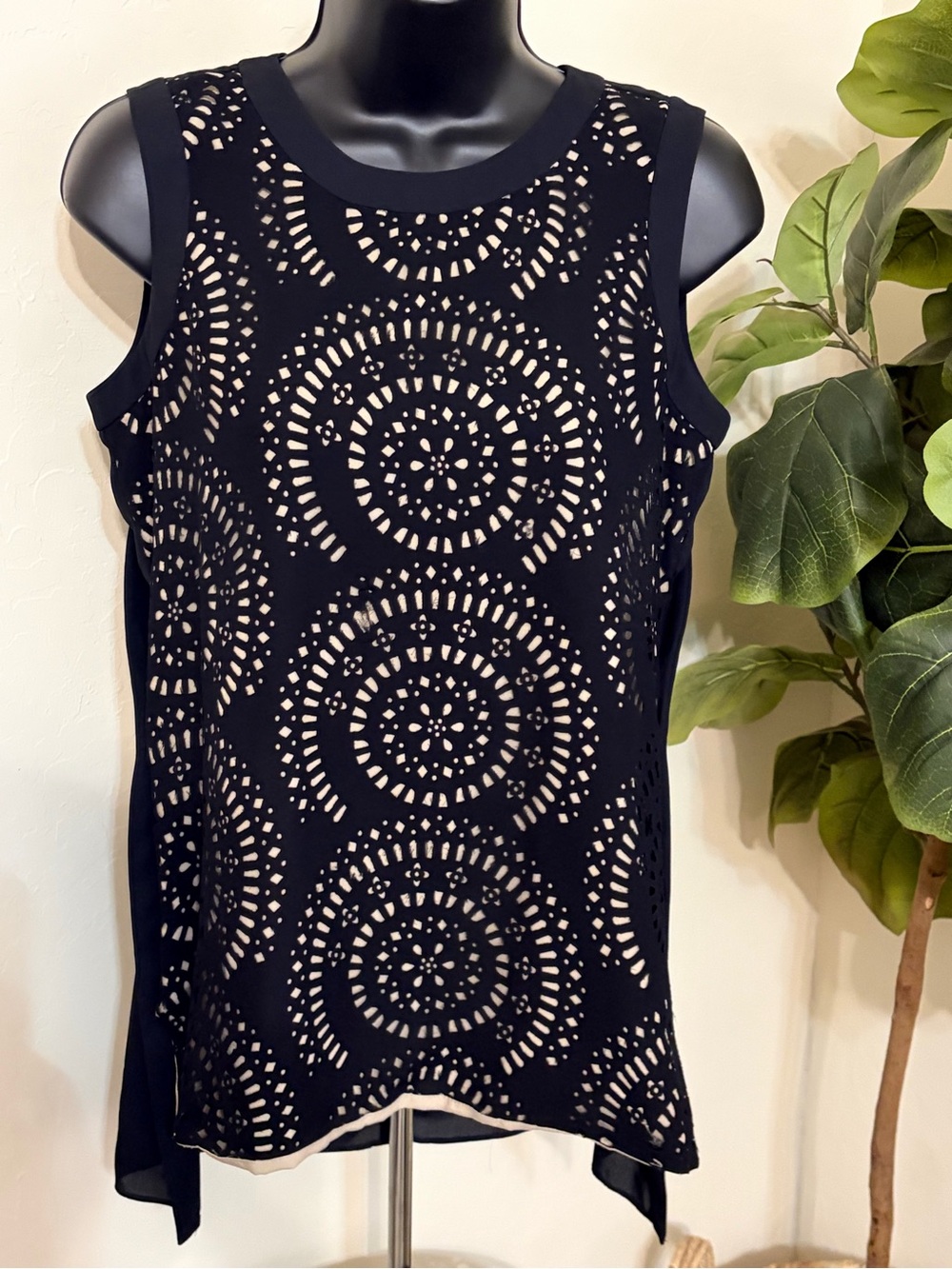 Womenโs Black Laser-Cut Sleeveless Top